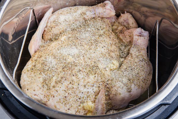 an entire chicken in an instant pot, dressed and ready to cook