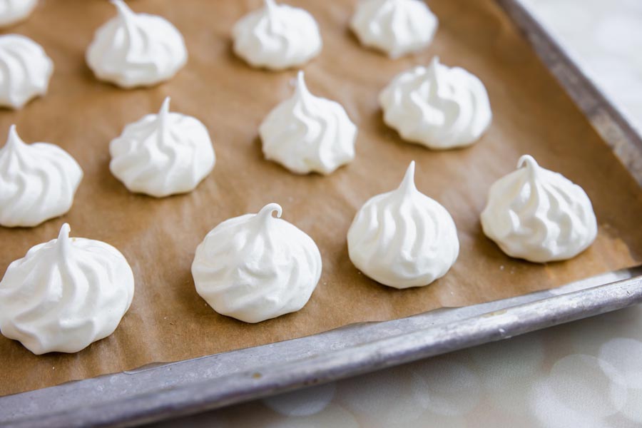 star meringue cookies on a baking tray in rows