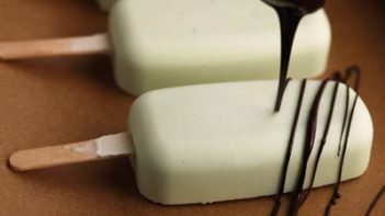drizzling chocolate on mint ice cream bars