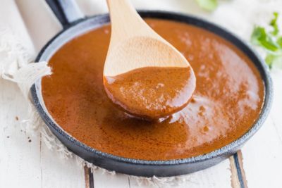 a spoonful of thick red mole sauce