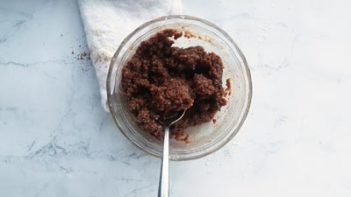 brownie batter in a small bowl with a spoon