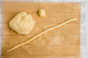 long strip of keto dough on parchment paper