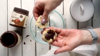 a scoop of creamy chocolate spread on a cookie