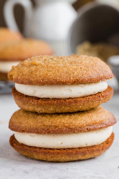 Two sandwich cookies stacked on each other.