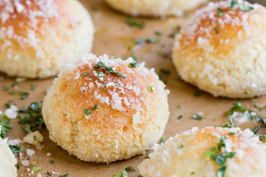 a golden bread puff topped with parmesan and parlsey
