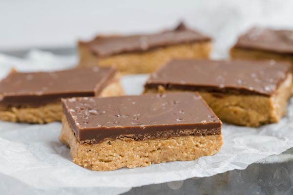 sliced bars of chocolate peanut on a parchment paper