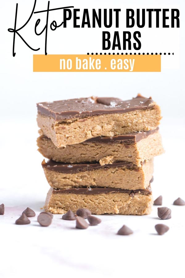 four peanut butter bars stacked up with chocolate chips around