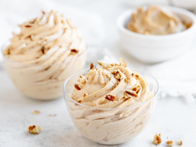 crushed peanuts on top of a swirled peanut butter mousse