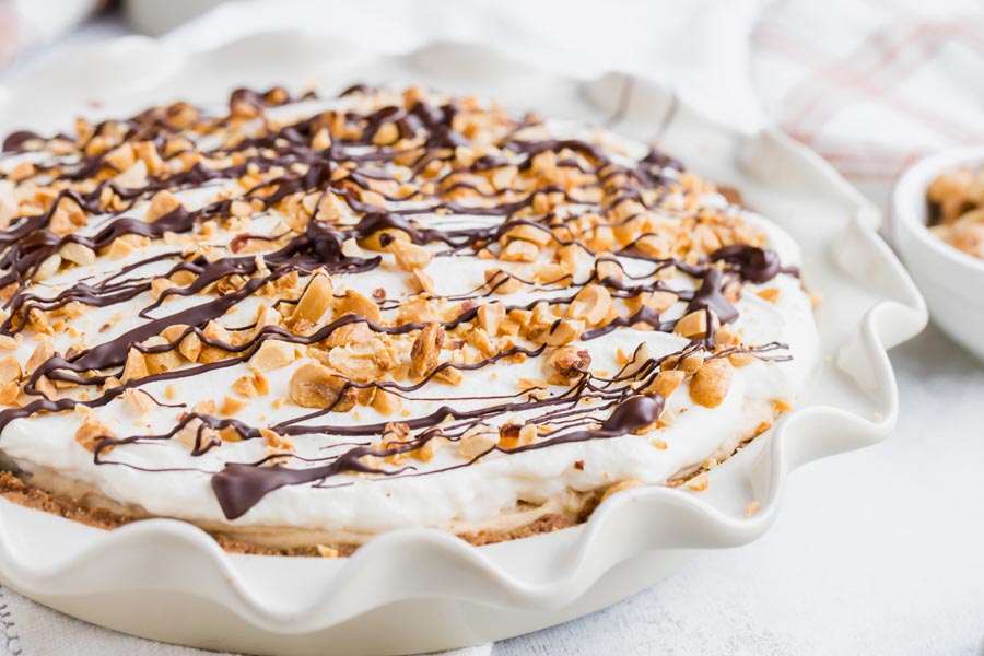 a whole peanut butter pie covered in chocolate and peanuts