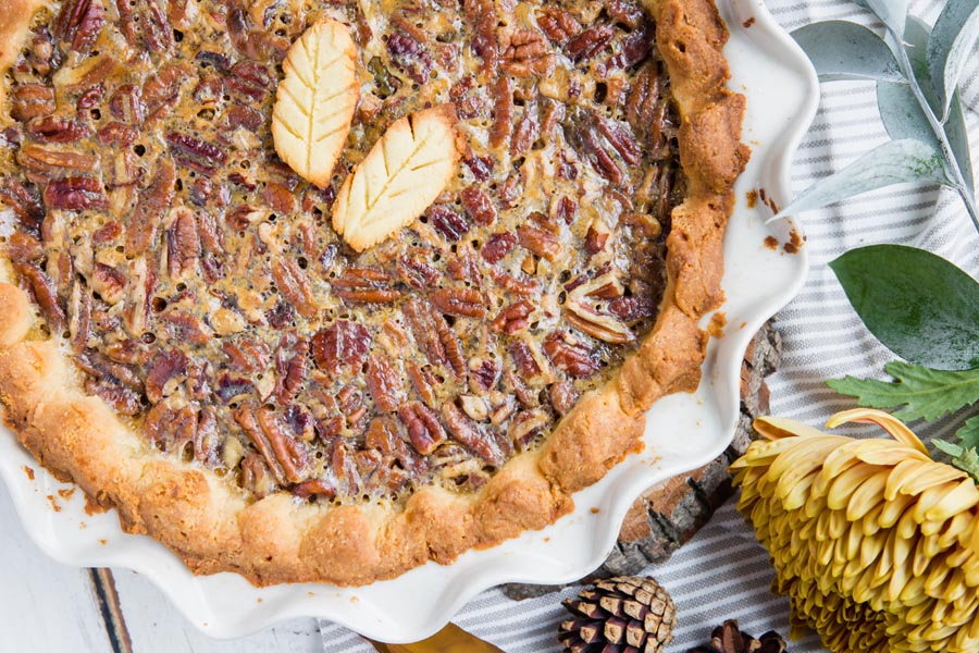 crusted pecans on a whole pie