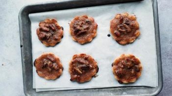 mini pecan pie cookies on a baking tray