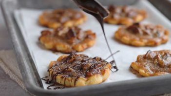 drizzling melted chocolate on a cookie