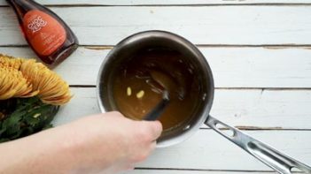 whisking butter into the sauce