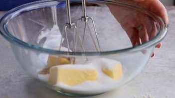 an electric mixer about ready to beat butter and sweetener together