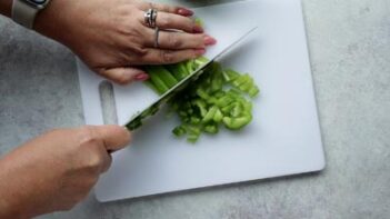 dicing green bell pepper with a knife