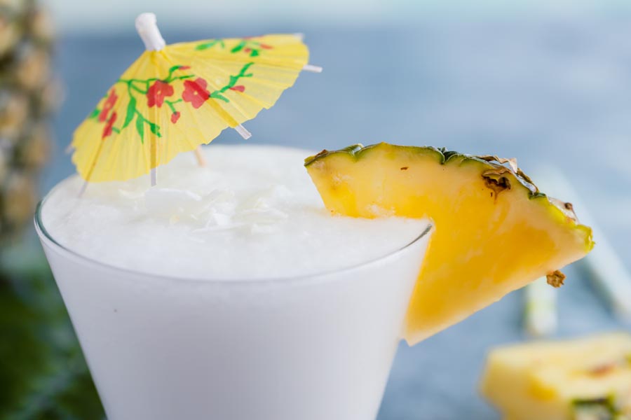 an umbrella drink with pineapple