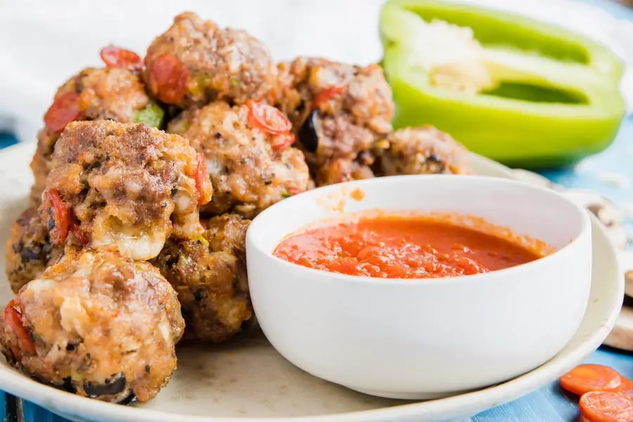 keto pizza meatballs on a plate with marinara sauce