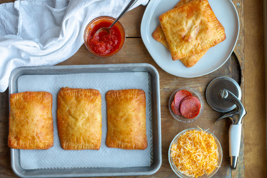 homemade pizza pocket spread with sauce