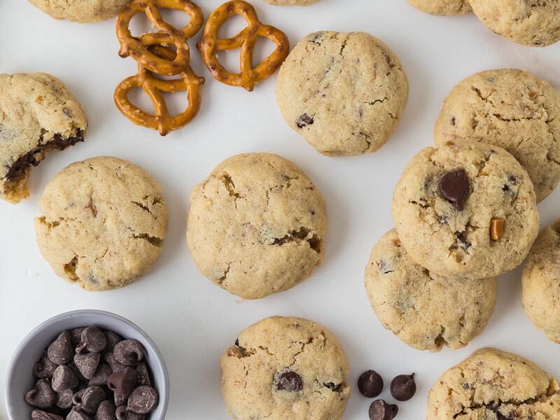 Overhead view of pretzel chocolate chip cookies with mini pretzels and chocolate chips.