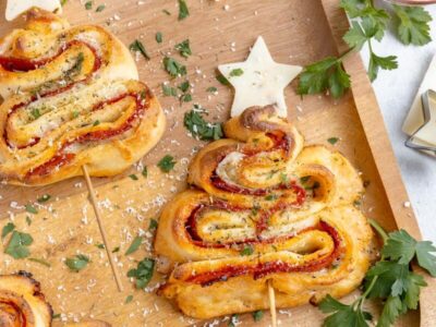 Keto puff pastry Christmas trees with parmesan, parsley and cheese stars.
