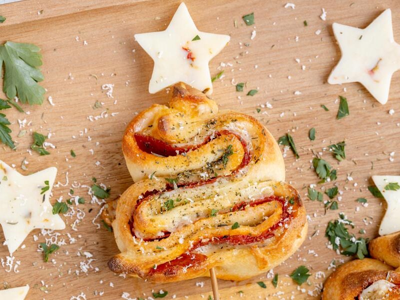Pepperoni and cheese puff pastry tree topped with a cheese star.