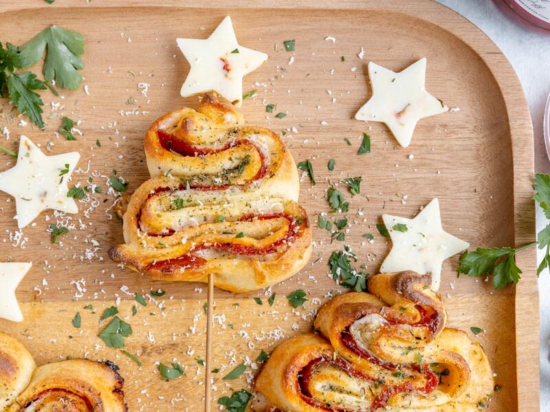 Puff pastry trees filled with pizza and topped with stars made of pepper jack cheese.