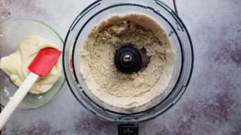 A food processer with almond flour inside.