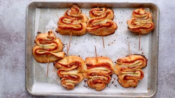 Baked Christmas tree appetizer on a tray.