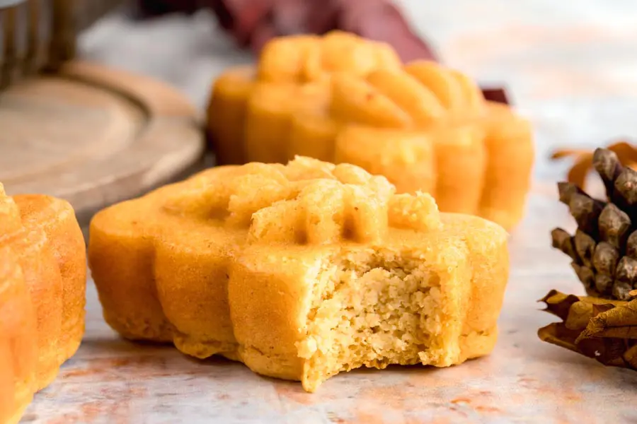 a bite taken out of a mini low carb pumpkin loaf