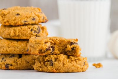 stack of keto pumpkin cookies with milk