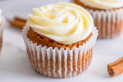 beautiful Fall inspired cream cheese topped pumpkin muffin