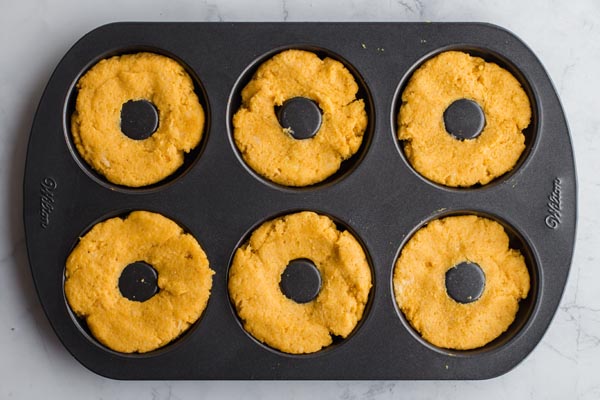 donuts in a pumpkin baking tray