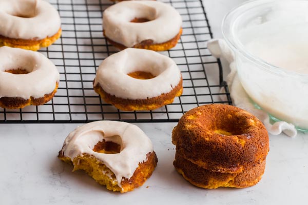 pumpkin donuts on a wire rack