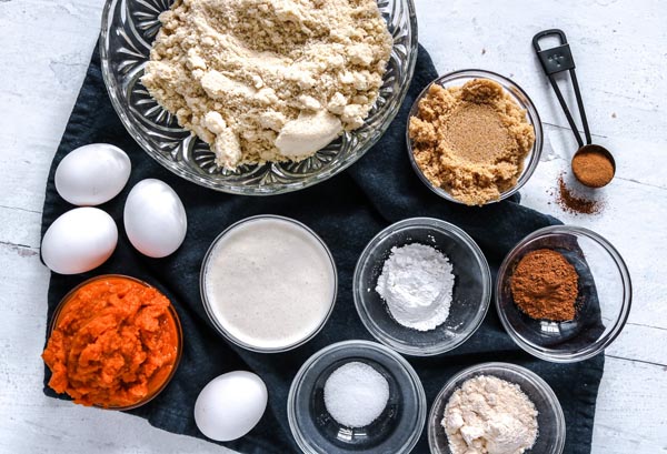 all the ingredients for pumpkin pecan muffins spread out