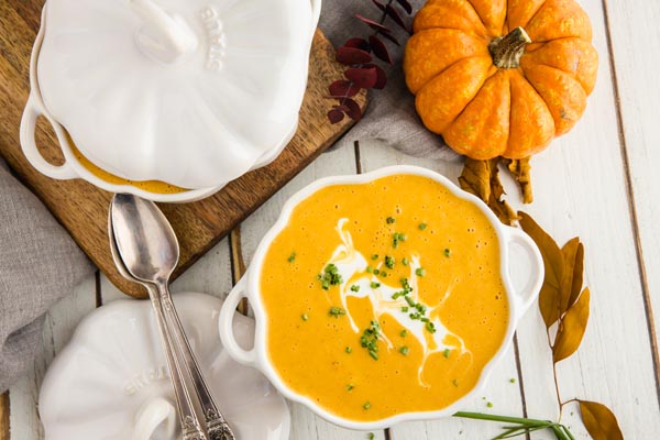 overhead view of keto pumpkin soup in a pumpkin shaped bowl