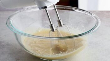 beating an egg mixture with an electric mixer