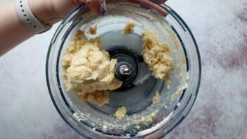 a food processor holding dough