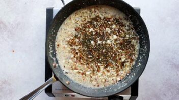 butter and seasoning cooking in a non-stick skillet