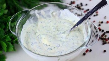 ranch dressing mixed and little in a small bowl with a fork in the bowl