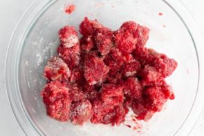 crushed raspberries in a bowl