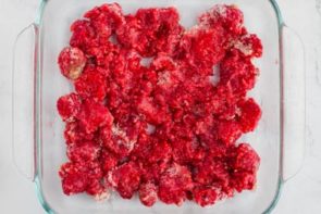 raspberry mixture spread out in a baking dish