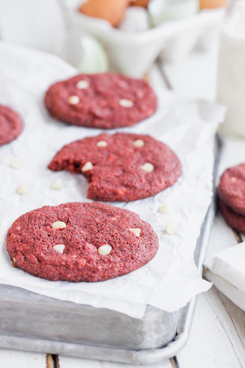 keto red velvet cookies on a baking tray lined with parchment paper