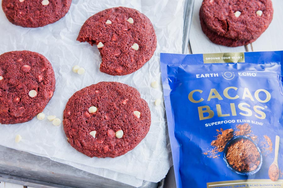 a bag of cacao bliss next to a tray of cookies