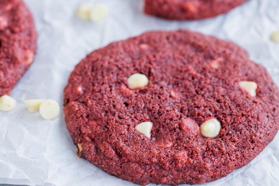 close up of white chips in a red velvet cookie