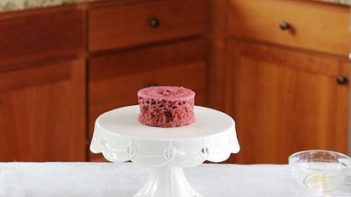 red velvet mug cake on a cake stand