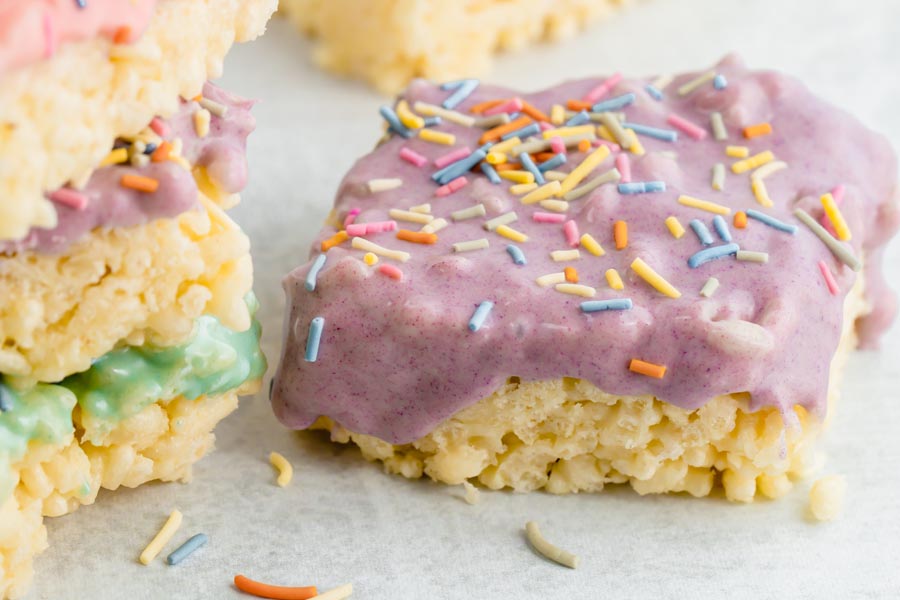 purple frosted keto rice crispy treat bar with sprinkles on top