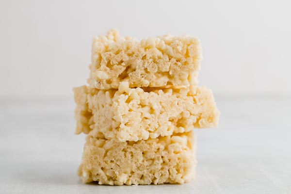 a stack of keto rice crispy treats on a white counter top