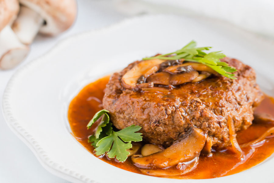 keto salisbury steak cooking in mushroom sauce