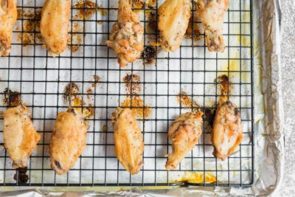 party wings baked on a tray on top of a wire rack