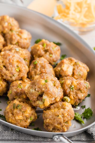 an oval skillet holding a mound of sausage balls